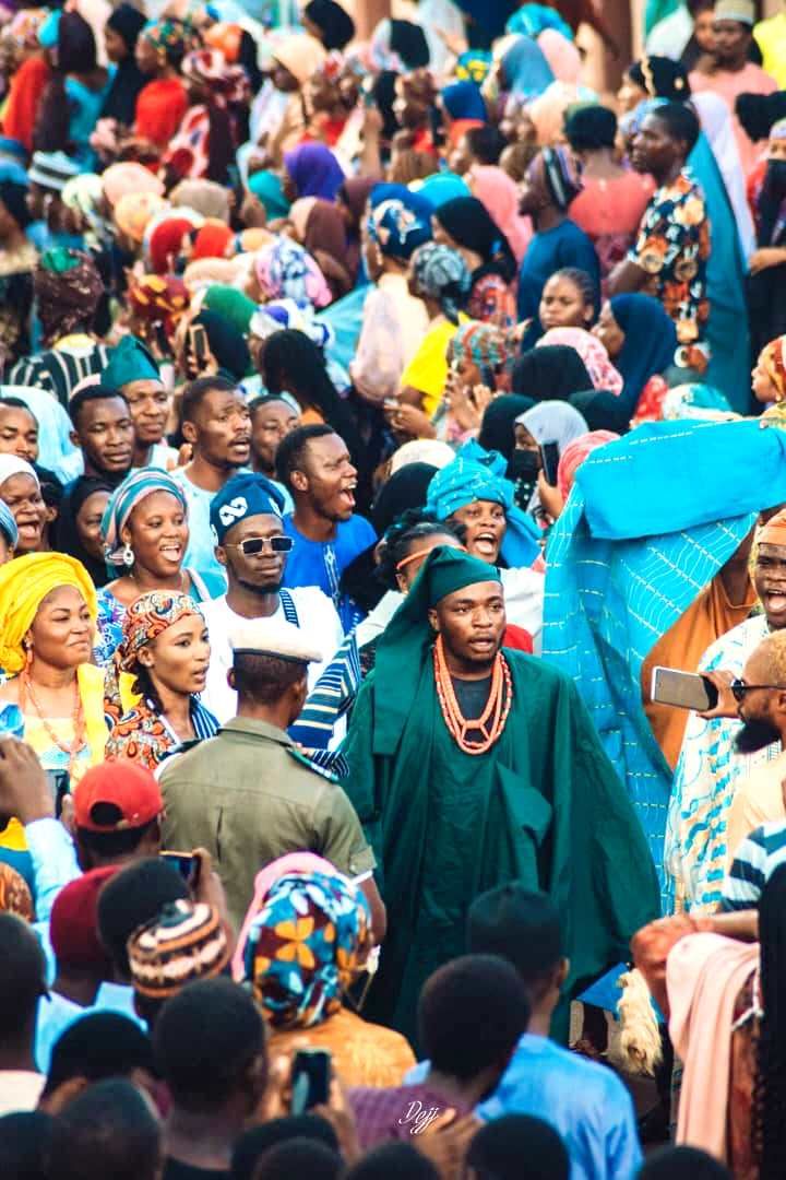 A celebration crowd in traditional dress
